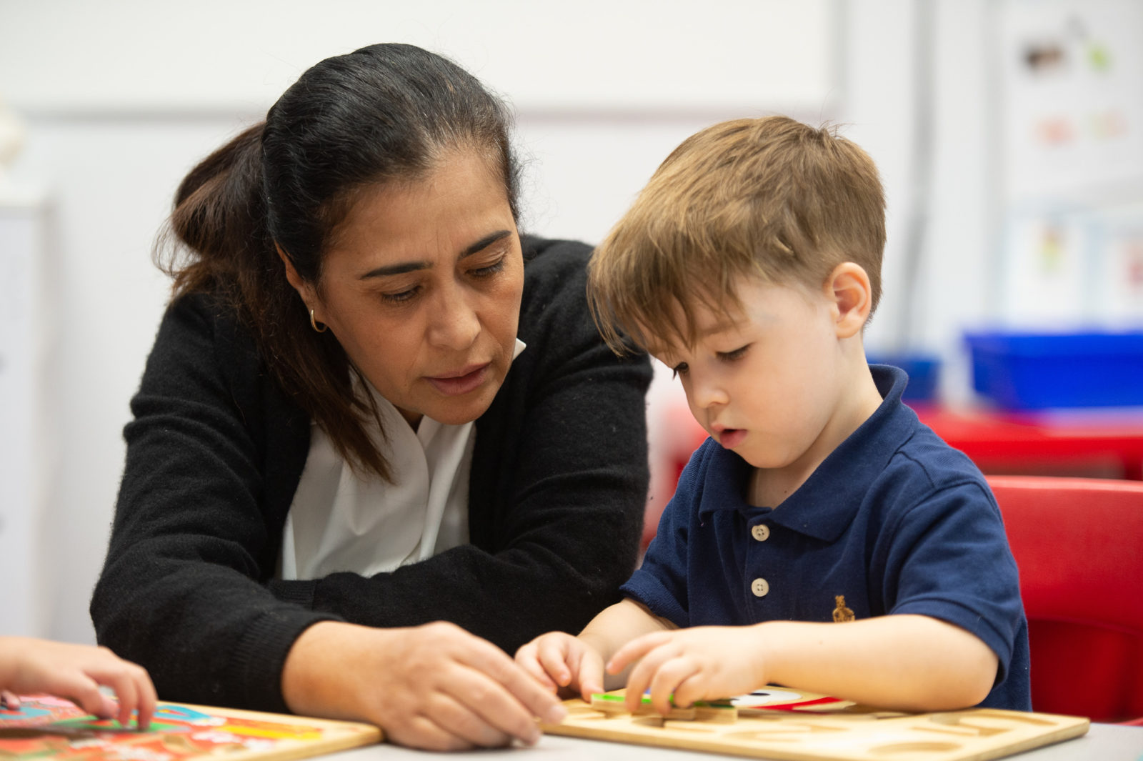 Educator working with student