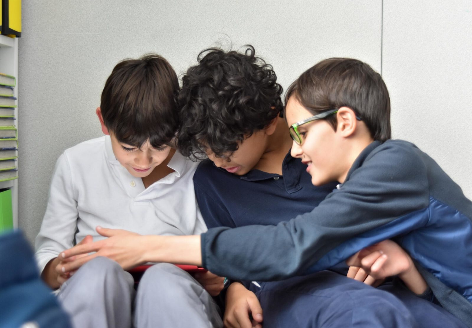 Boys using technology in class