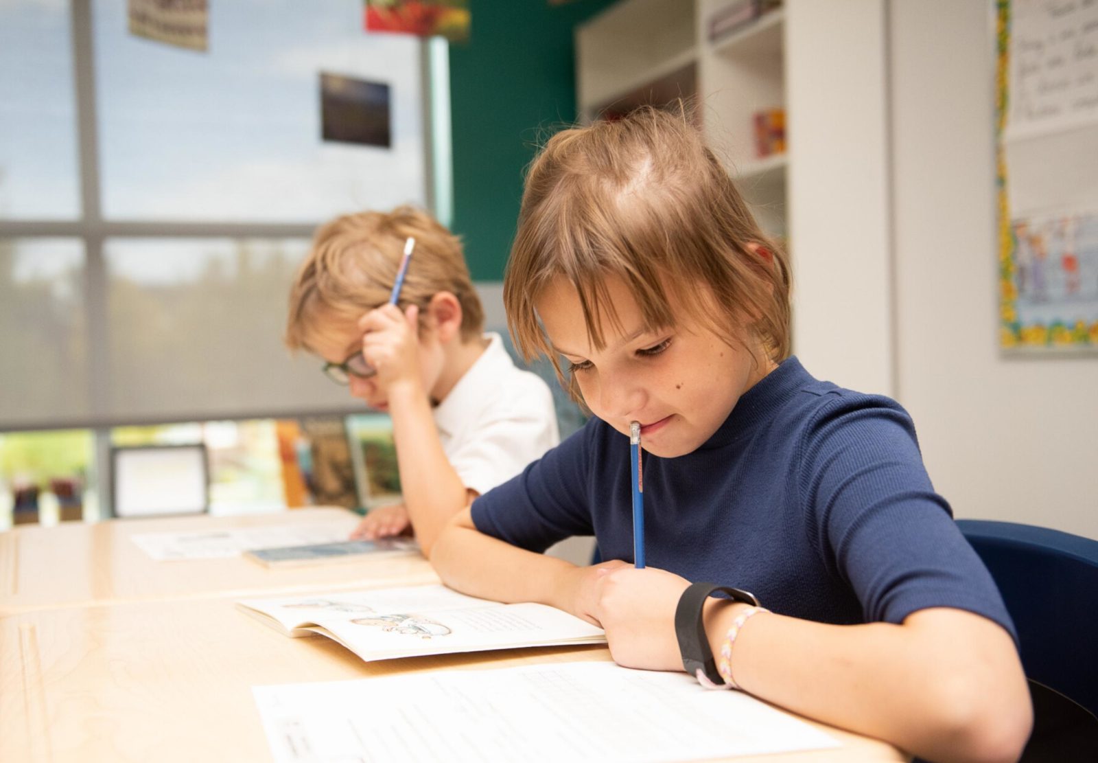 Girl student completing school work